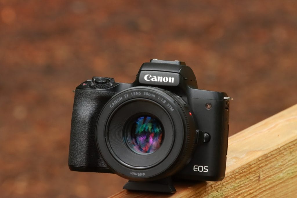 Canon EOS 5D Mark II sitting on a wooden ledge